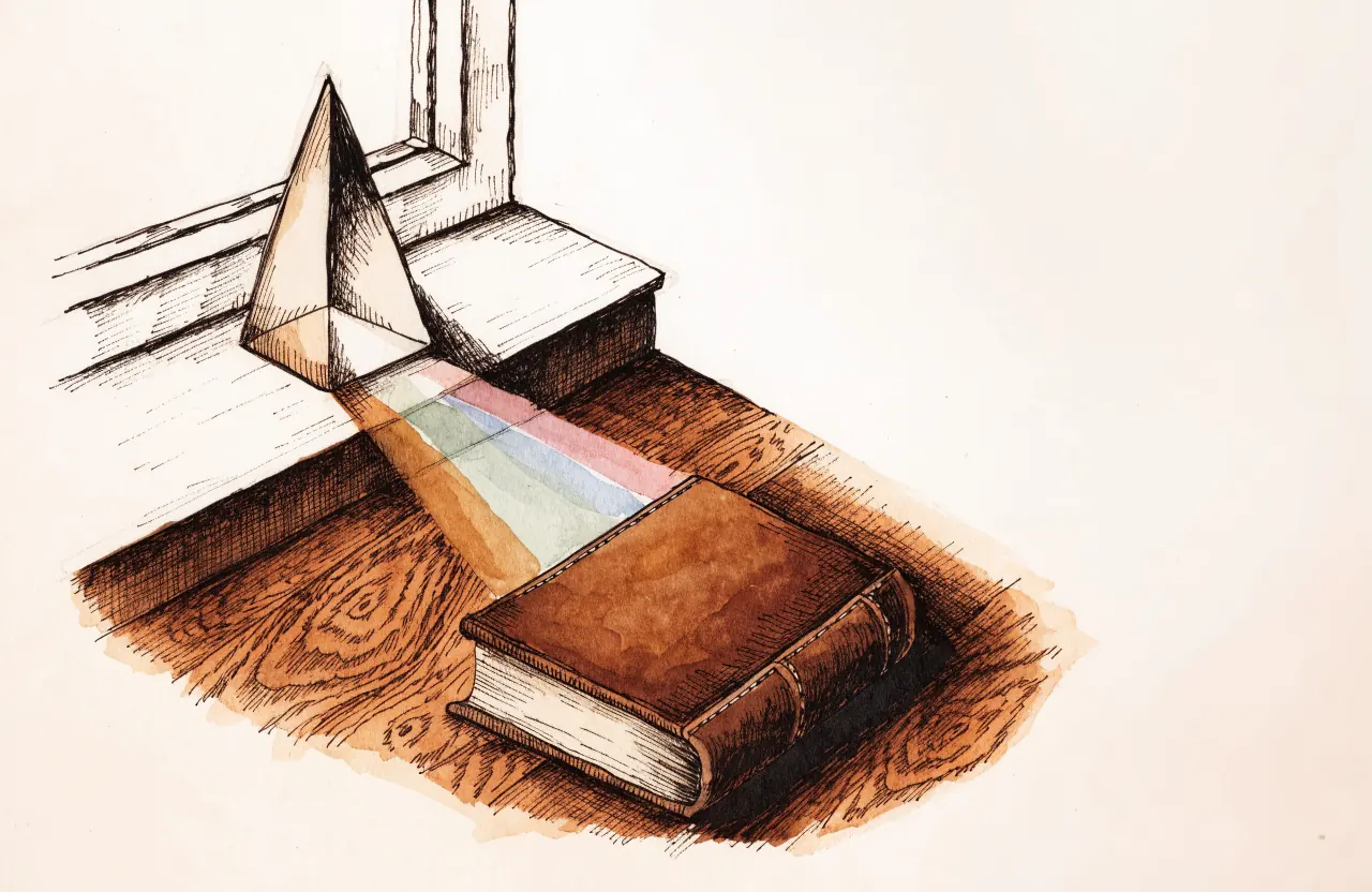 A glass prism on a windowsill casting a soft band of muted colors across an old wooden table toward a leather book