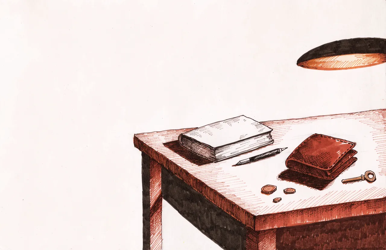 A table under a hanging lamp with a closed book, a pen, a leather wallet, a few coins and a key