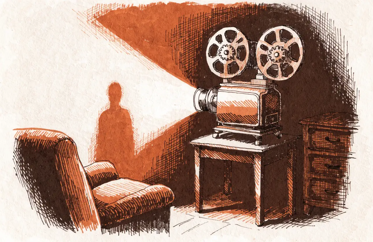 A film projector on a side table throws the silhouette of a person onto the wall of a dim room, with no one standing in the beam